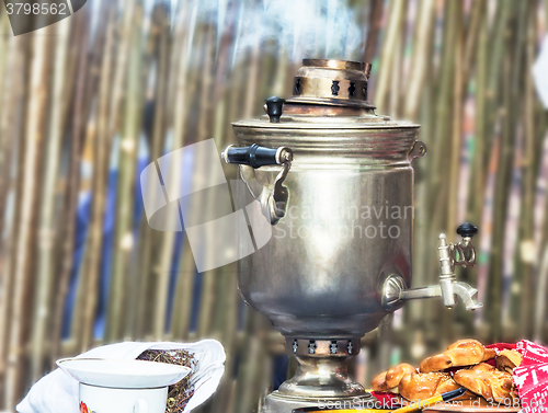 Image of Boiling tea from the old samovar.