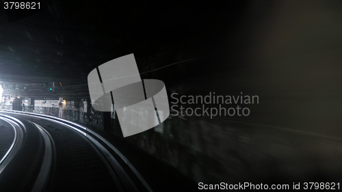 Image of Fast subway train under blue and yellow light