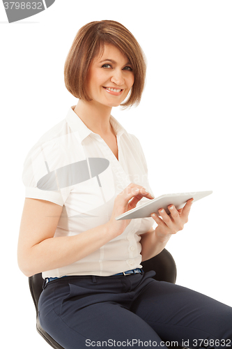 Image of Beautiful smiling businesswoman holding pad 