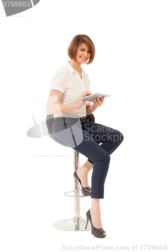 Image of Elegant smiling woman holding tablet