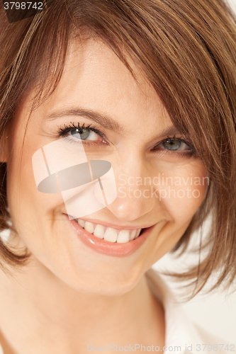 Image of Adult smiling brunette in close-up.