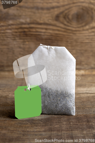 Image of Teabag on wooden background   