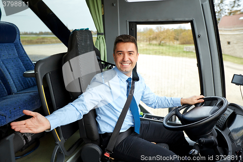 Image of happy driver inviting on board of intercity bus