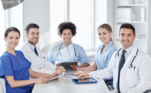 Image of group of happy doctors meeting at hospital office