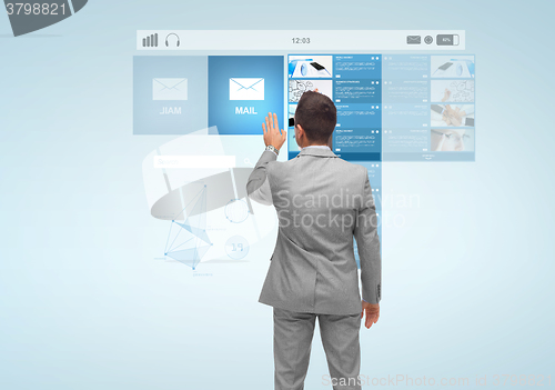 Image of businessman with virtual projection of e-mail