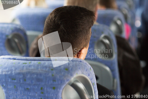 Image of close up of man sitting in travel bus