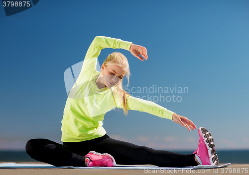 Image of woman doing sports outdoors