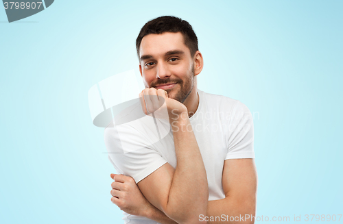 Image of smiling man over blue background