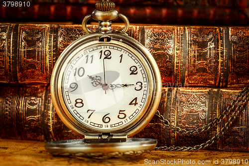 Image of Old Books and Vintage pocket watch