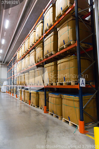 Image of cargo boxes storing at warehouse shelves