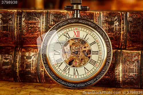 Image of Old Books and Vintage pocket watch