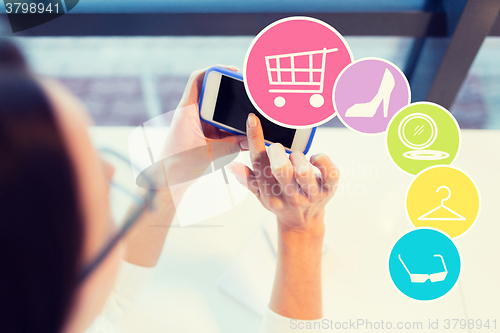 Image of close up of woman with smartphone at office