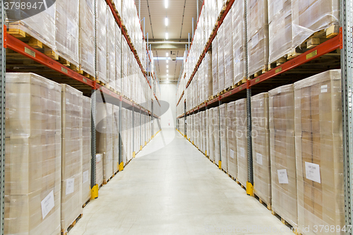 Image of cargo boxes storing at warehouse shelves