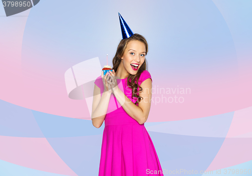 Image of happy woman or teen girl with birthday cupcake