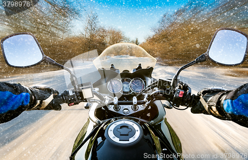 Image of Biker First-person view. Winter slippery road