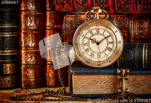 Image of Old Books and Vintage pocket watch