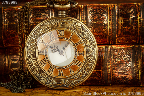 Image of Old Books and Vintage pocket watch