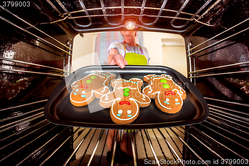 Image of Baking Gingerbread man in the oven