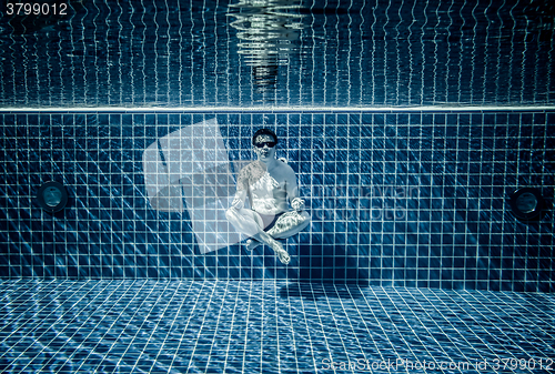 Image of Persons lies under water in a swimming pool