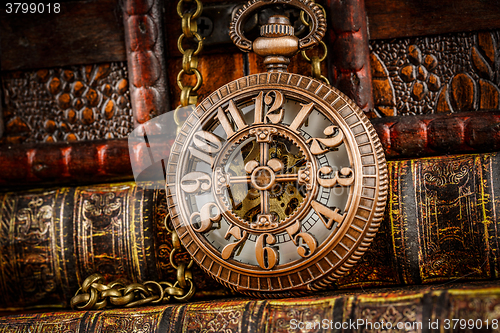 Image of Old Books and Vintage pocket watch