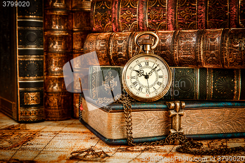 Image of Old Books and Vintage pocket watch