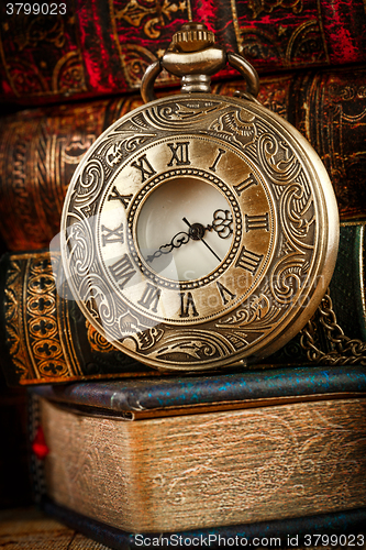 Image of Old Books and Vintage pocket watch