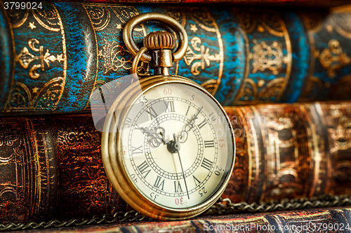 Image of Old Books and Vintage pocket watch