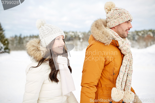 Image of happy couple walking over winter background