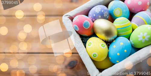 Image of close up of colored easter eggs in basket