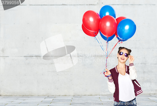 Image of happy teenage girl with helium balloons