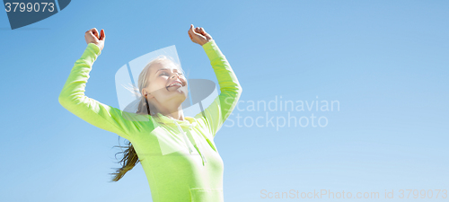 Image of woman runner celebrating victory