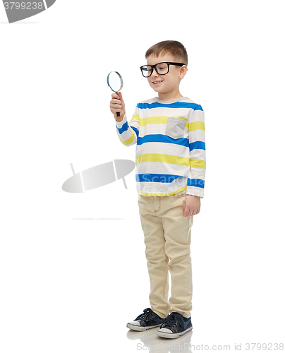Image of little boy in eyeglasses with magnifying glass
