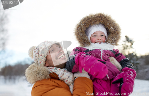 Image of happy family in winter clothes outdoors