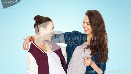 Image of happy smiling pretty teenage girls hugging