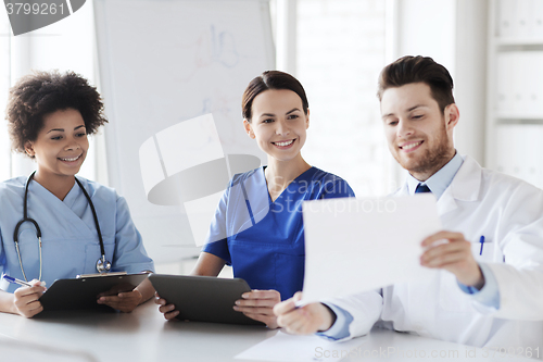 Image of group of happy doctors meeting at hospital office