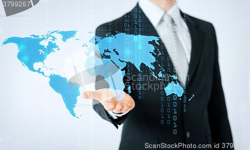 Image of close up of man showing world map and binary code