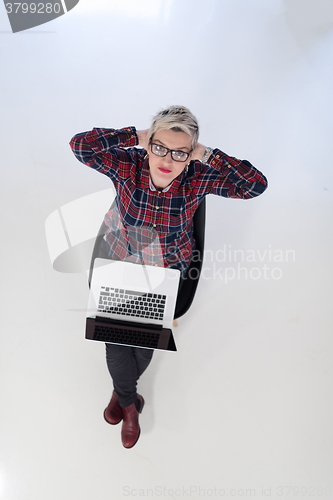 Image of top view of young business woman working on laptop computer