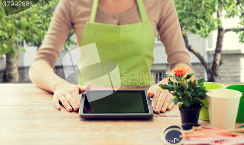 Image of close up of woman or gardener with tablet pc