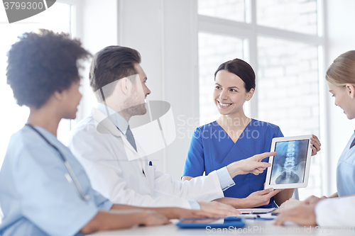 Image of group of happy doctors meeting at hospital office