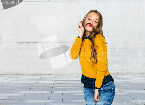 Image of happy young woman or teen girl in casual clothes