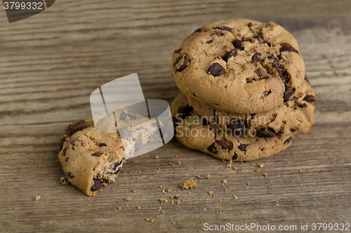Image of Brown cookies on wooden background