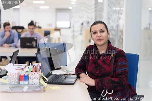 Image of startup business, woman  working on laptop