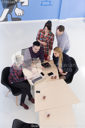 Image of aerial view of business people group on meeting