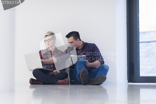 Image of startup business, couple working on laptop computer at office