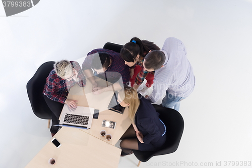 Image of aerial view of business people group on meeting