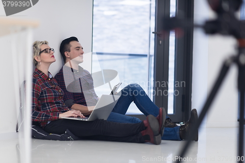 Image of startup business, couple working on laptop computer at office