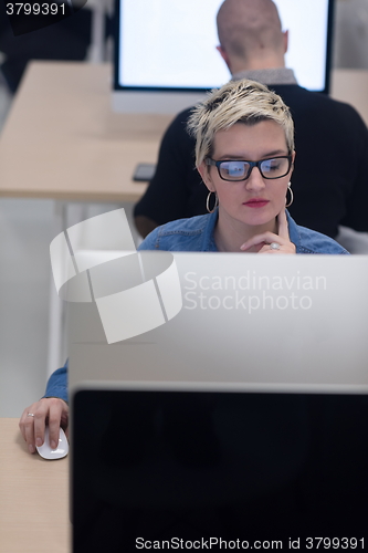 Image of startup business, woman  working on desktop computer