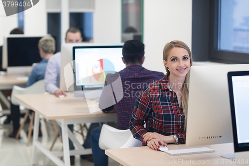 Image of startup business, woman  working on desktop computer