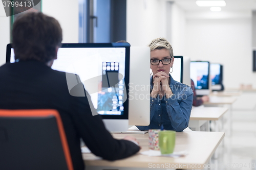 Image of startup business, woman  working on desktop computer