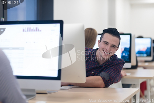 Image of startup business, software developer working on desktop computer